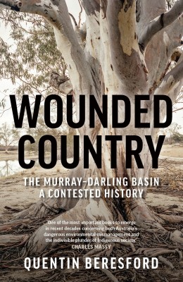 Cover of Wounded Country – the Murray-Darling Basin: A contested history by Quentin Beresford. A big gum tree with some stripped bark sits on a riverbank