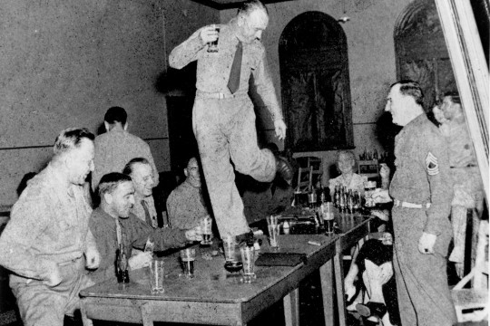 An American soldier dances on the table at Eagle Farm, Brisbane, in the 1940s