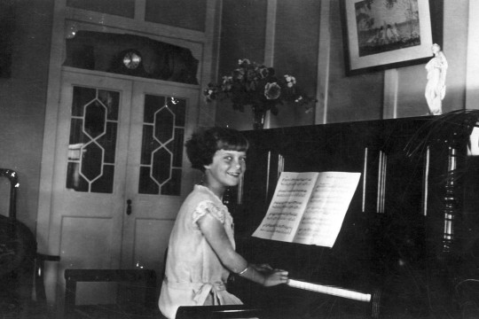 A young Letty at the piano. 