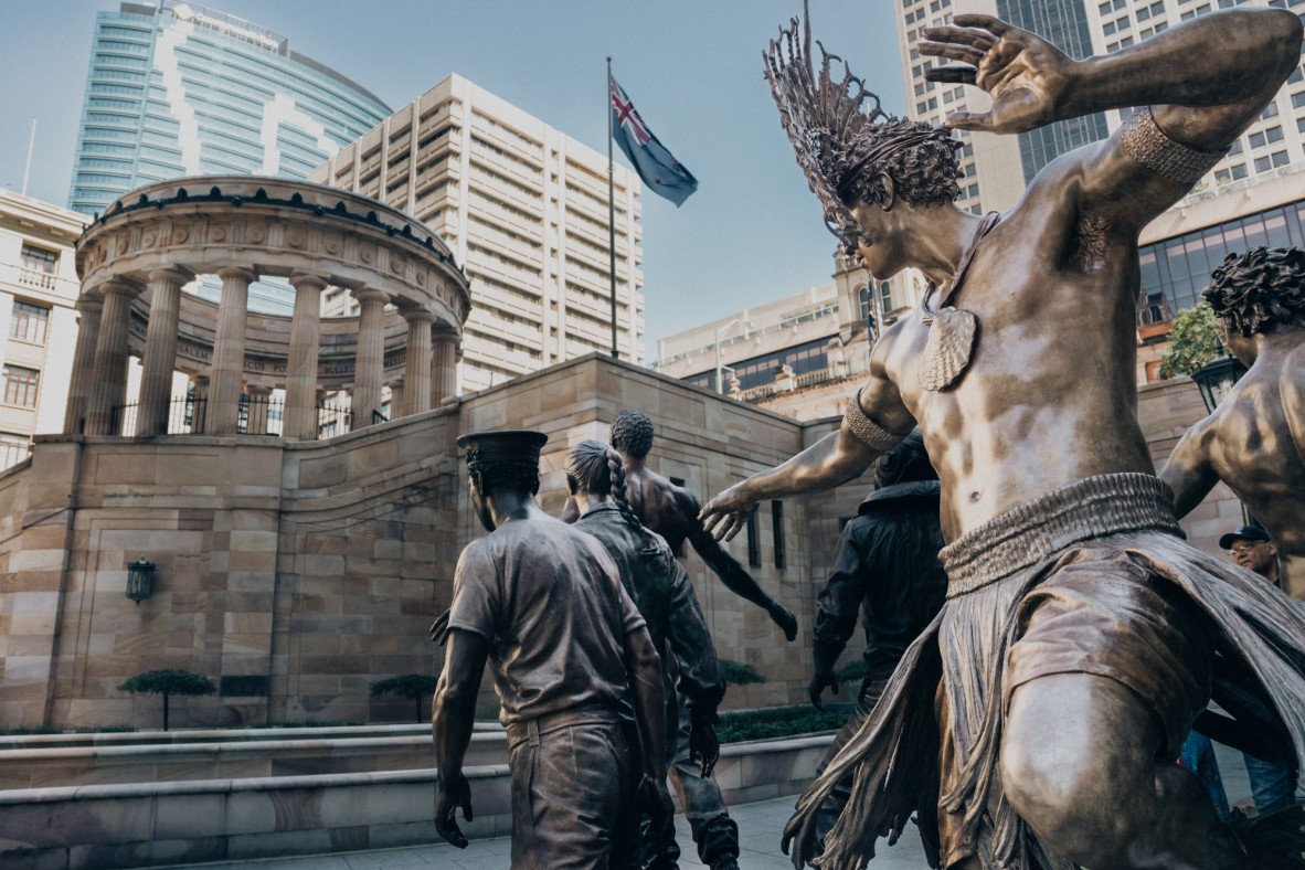 Bronze memorial dedicated to Queensland's Aboriginal and Torres Strait Islander service men and women. It features life-size figures standing on a Journey Stone. Navy, Army and Air Force are represented alongside Aboriginal and Torres Strait Islander warriors / dancers, depicting a story of embarkation from home via air, land and sea.