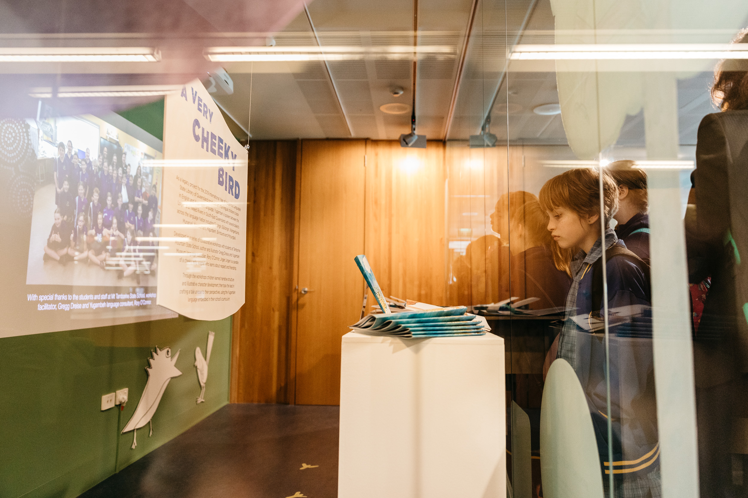 TBC Person looking at exhibition