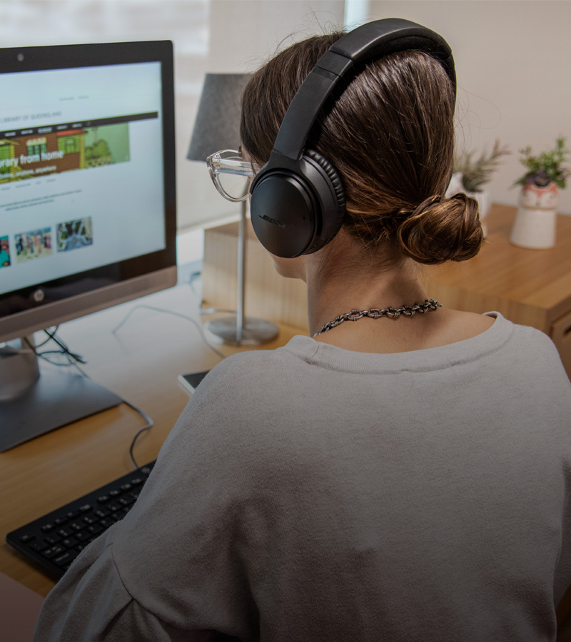 Woman sitting at a desk using a computer