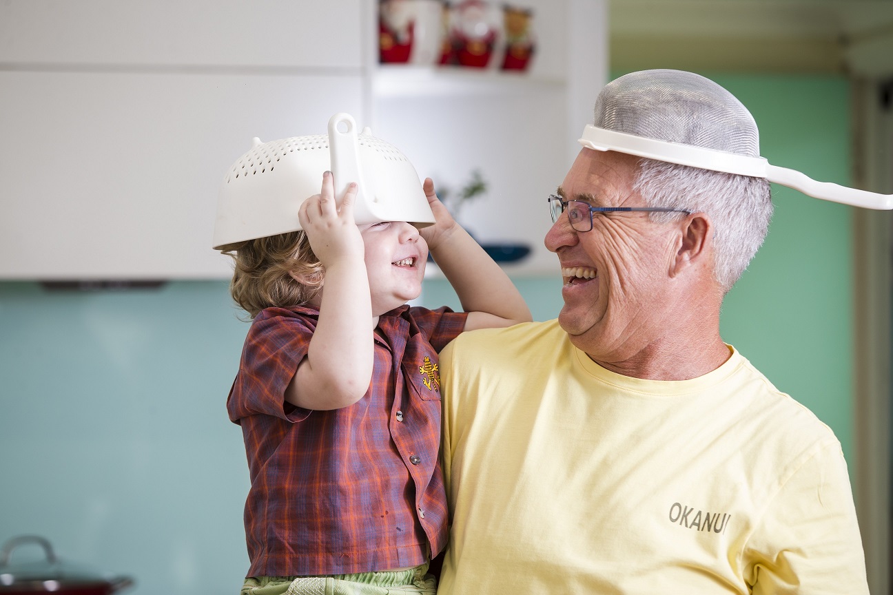 Older man and child being silly