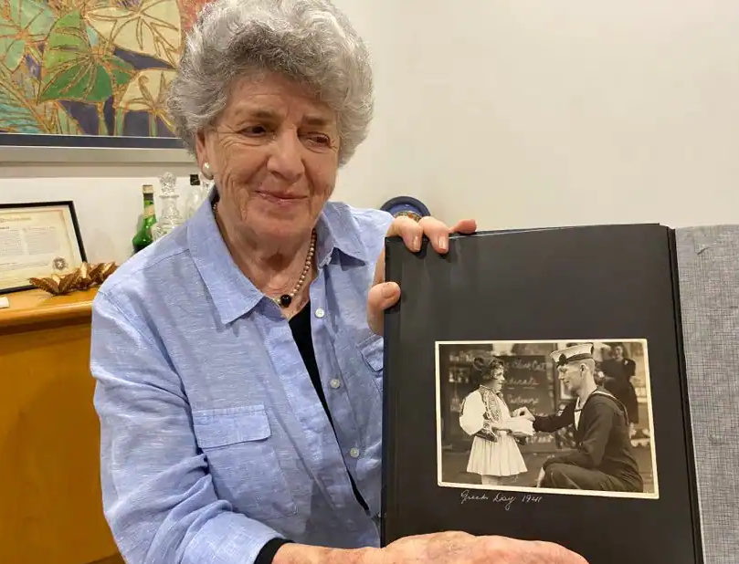 Julie Nichels holding the picture that made her famous within the community
