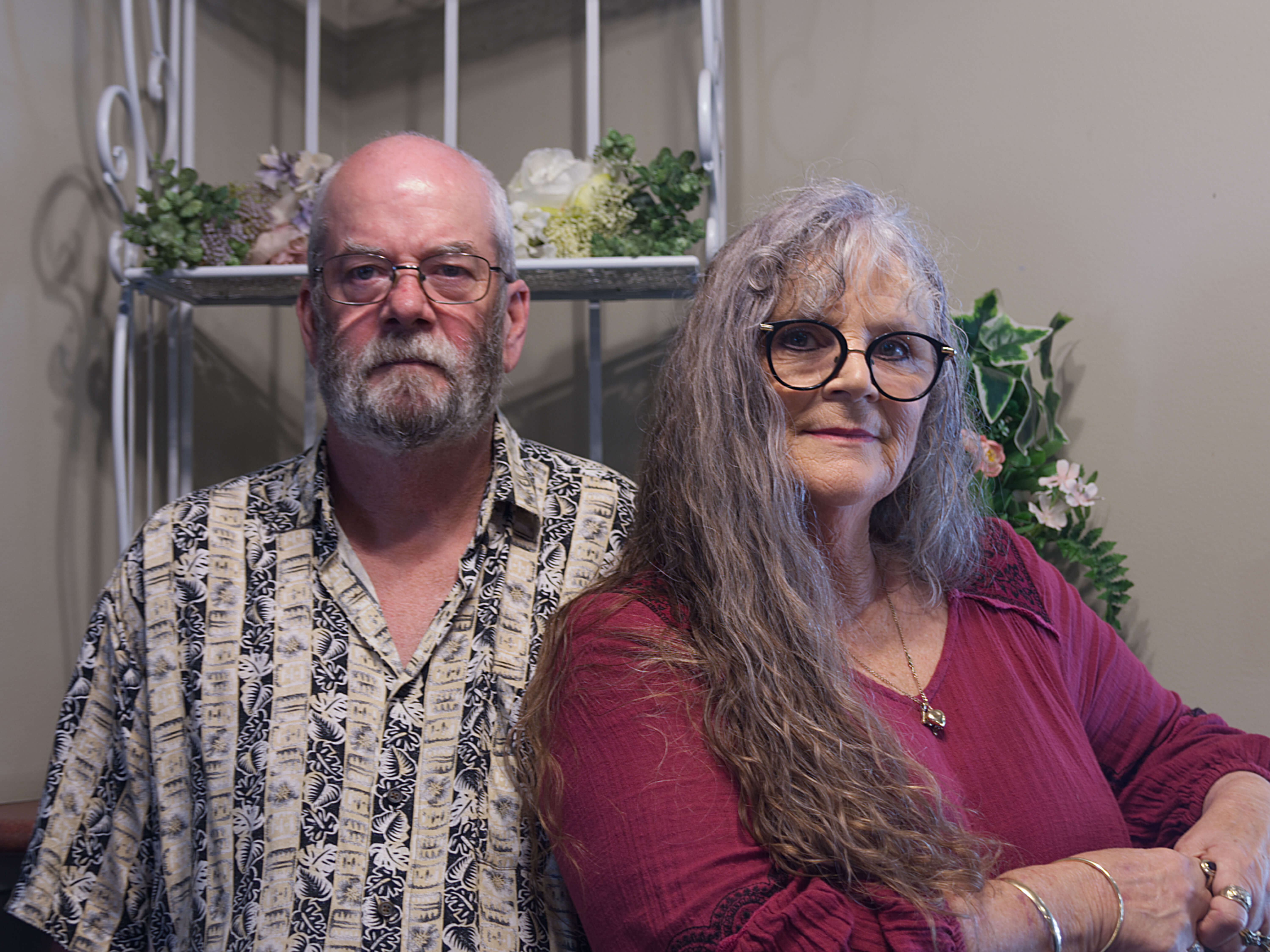 photographic portrait of Kim and Peter Wilson, man and woman smiling at the camera