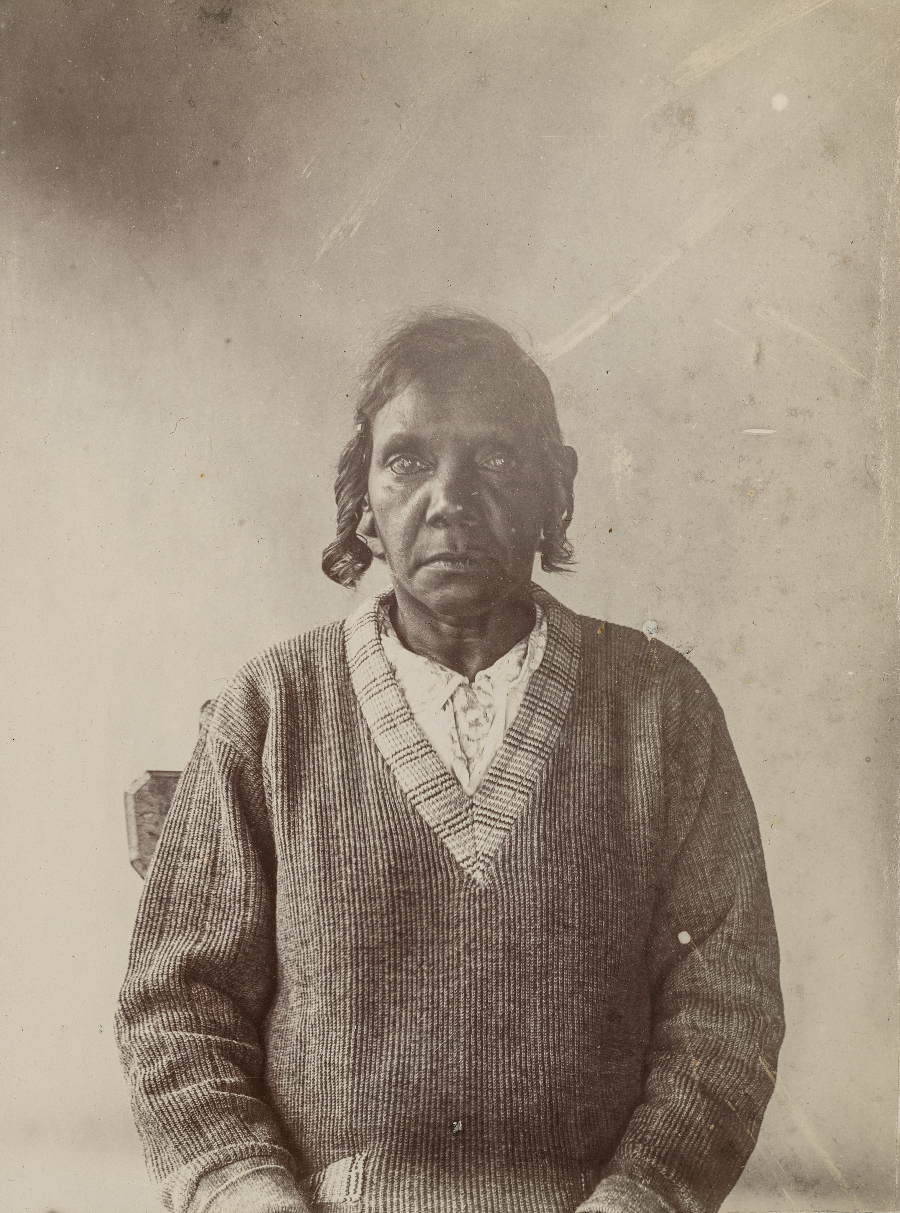 Black and white portrait from 1932 of an Aboriginal woman looking into the camera.