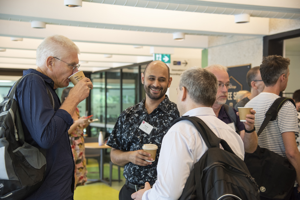 Attendees talking at Making Meaning