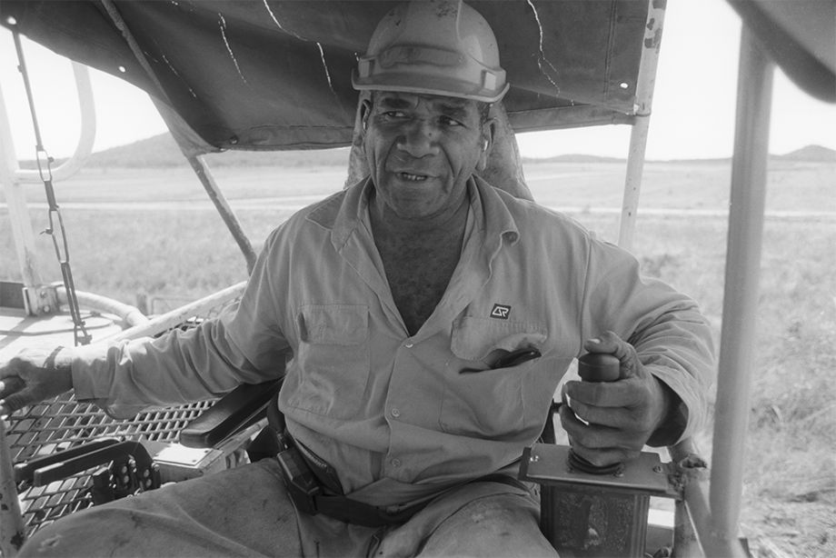 Paul Tatou operating a railway track laying machine near Bowen, Queensland 