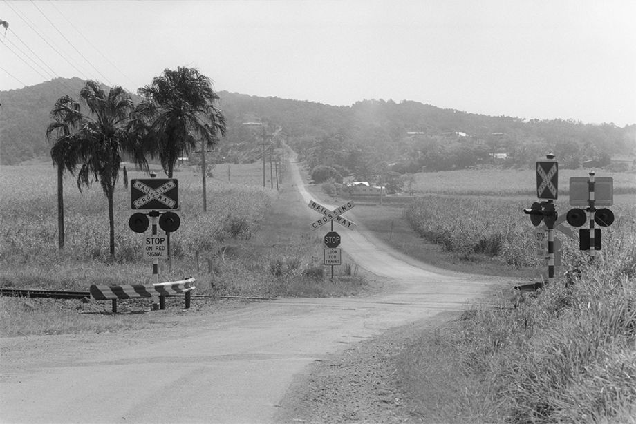 Railway crossing on the road heading towards Farleigh Sugar Mill, near Mackay, Queensland, 2000