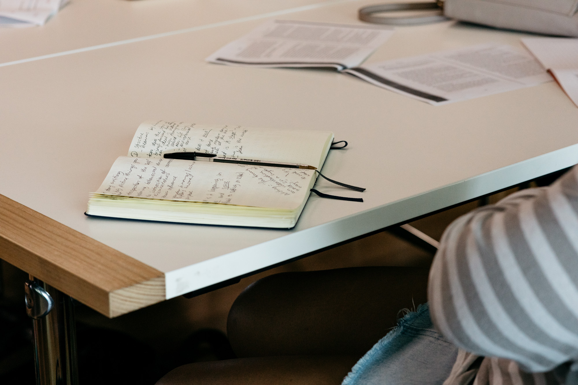 Writing Opportunities Notebook with notes on table
