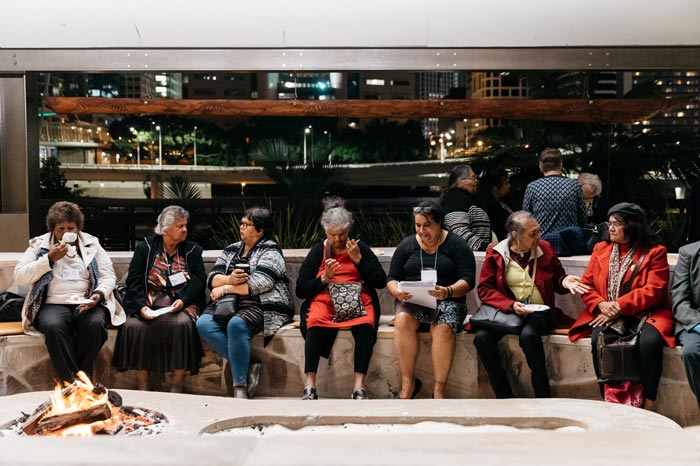 Cherbourg matching girls sitting together at the talking circle. Photo by Josef Ruckli.