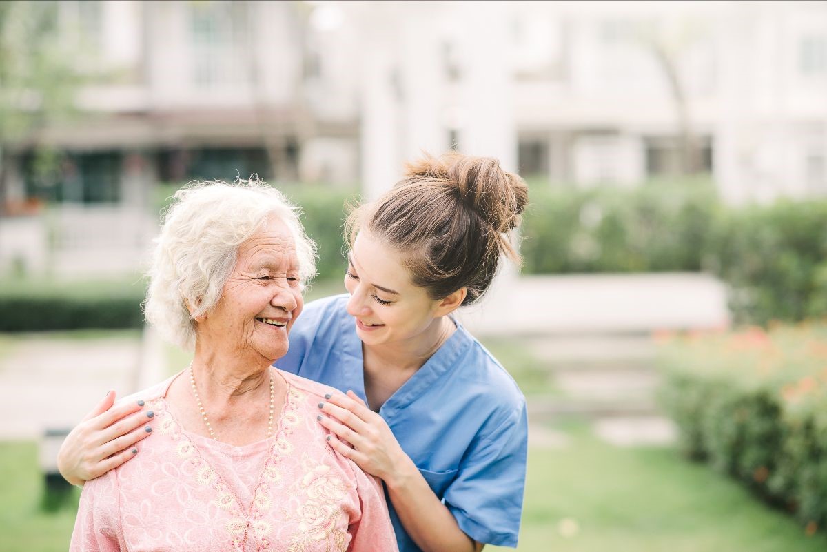 Rethinking aged care An aged care nurse with elderly woman