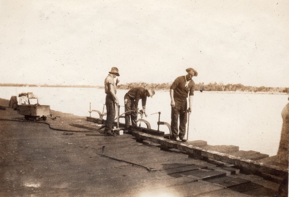 The timber used on the deck was ironbark or tallowwood, sourced from Conondale, Mapleton or Kilcoy. It was soaked in a hot creosote bath prior to use to preserve against decay, insects, weather and fire. 2.5 million super feet of timber was used in the building of the Bridge