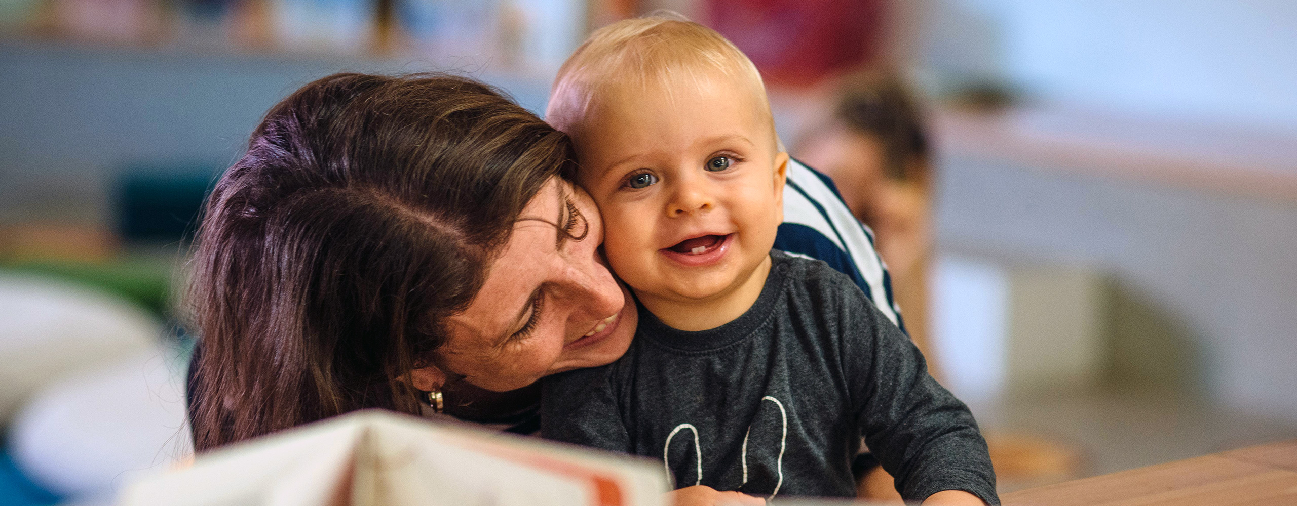 Mum and baby smiling