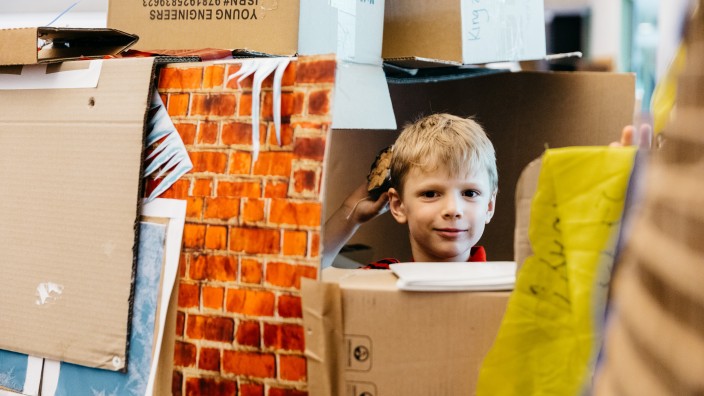 Boy in a cardboard construction 