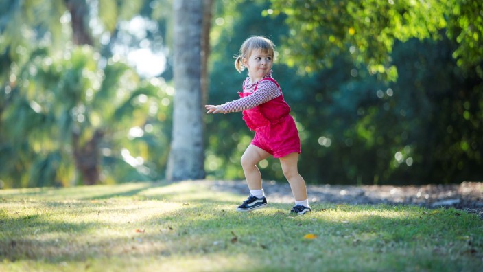 Toddler running in park