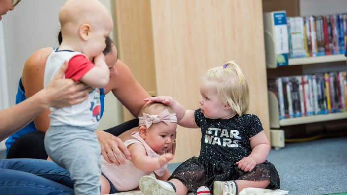 Babies attend a Baby Play session at a library in Mackay. Photo by Elizabeth Andrews. Babies attend a Baby Play session at a library in Mackay