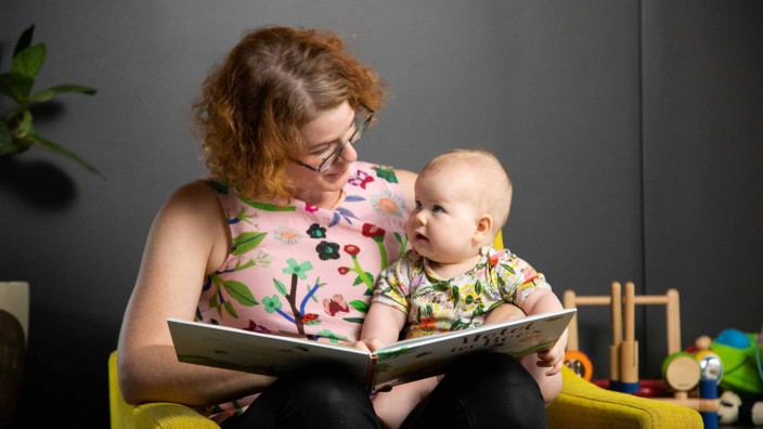 Mother and baby reading a book