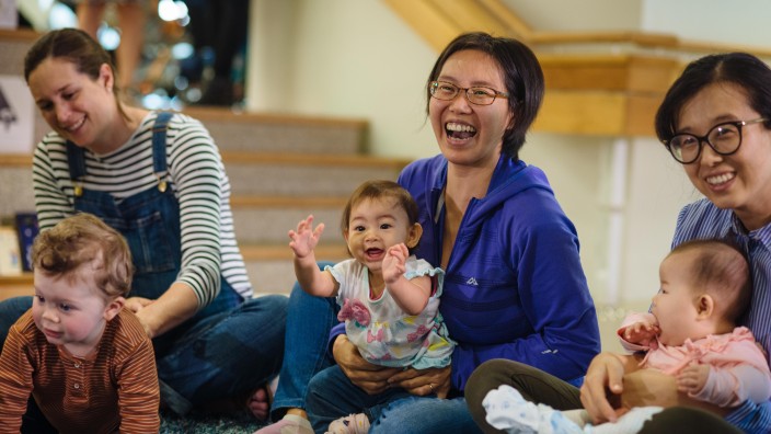 Parents and babies clapping and laughing