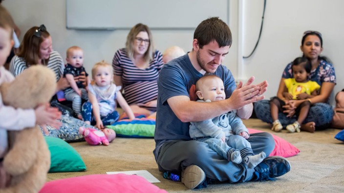 Father and son clapping