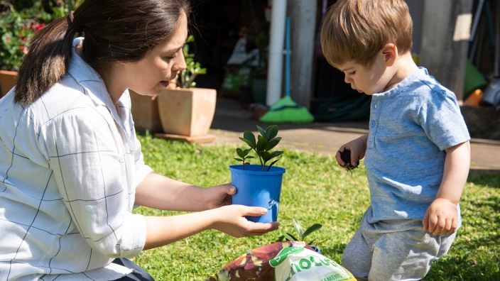 Mother and boy gardening
