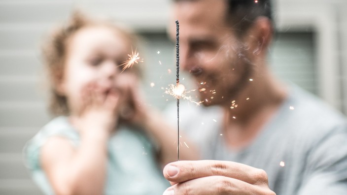 Father and toddler with sparkler