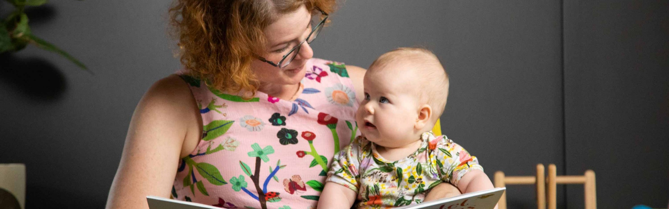 Mother and baby reading a book