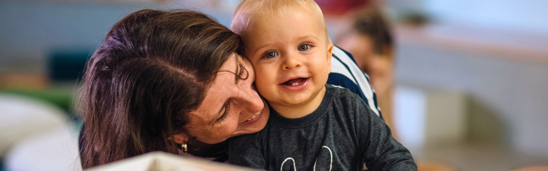 Mum and baby smiling