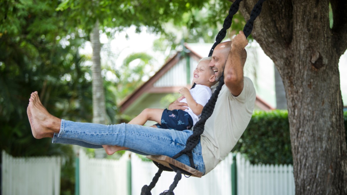 Father and son on swing