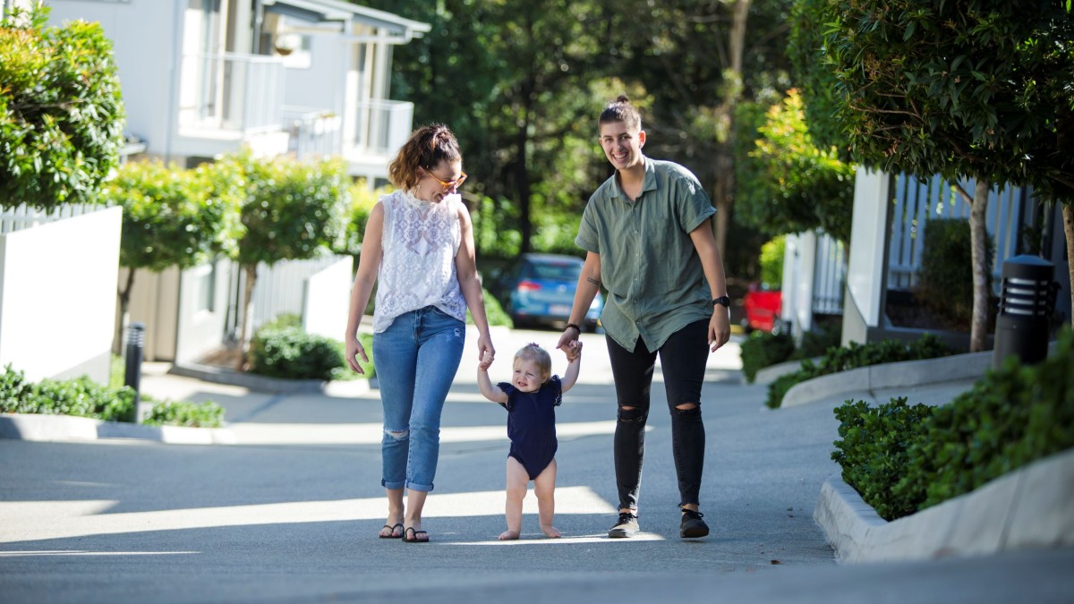 Family walking with baby outside