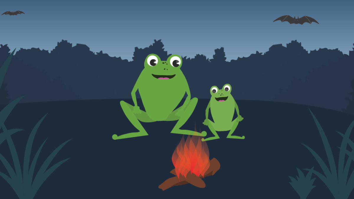 A bigger frog and a smaller frog are sitting beside a campfire