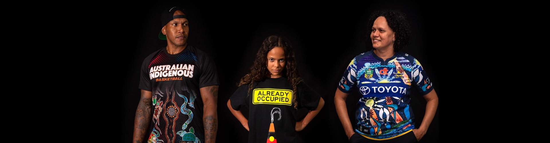 People wearing Indigenous shirts