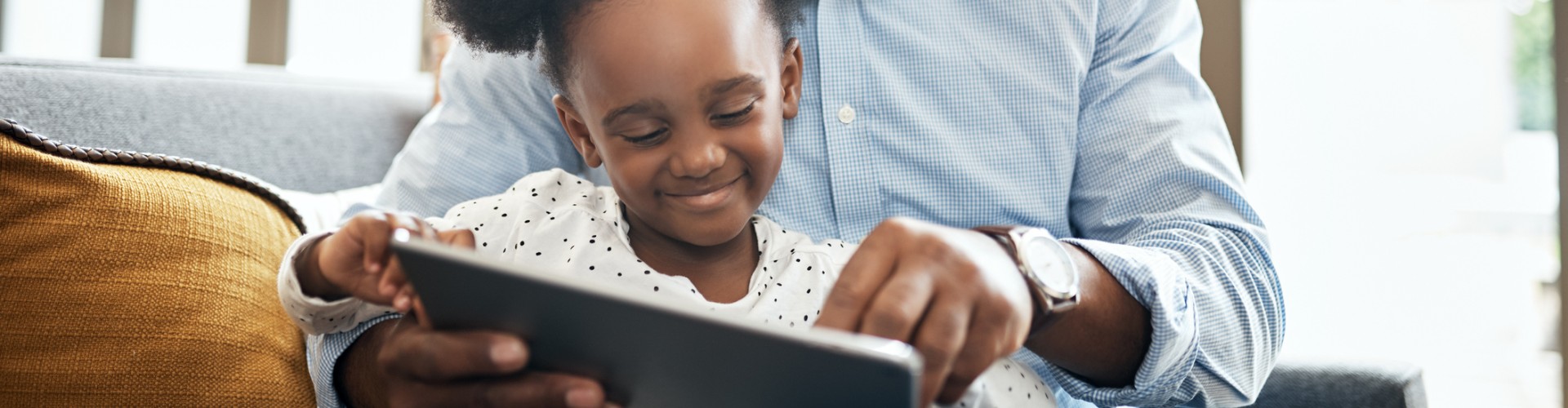 Man and child reading a book