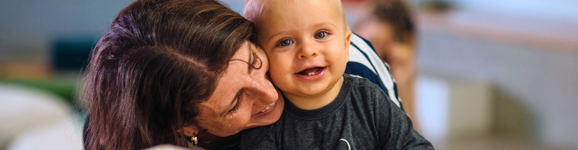 Mum and baby smiling