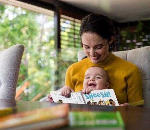 Mother and daughter reading Shoosh! board book