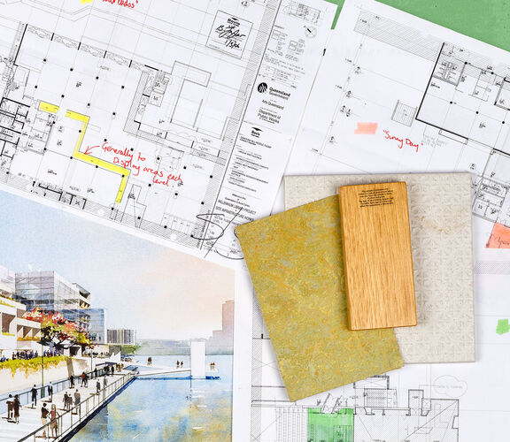 Flat lay of architectural plans, drawings and items from the Millennium Library Project