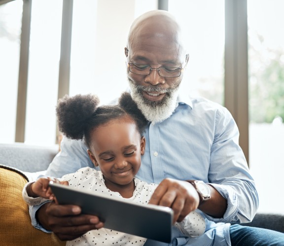 Man and child reading a book