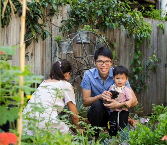 Mother, father and child in garden