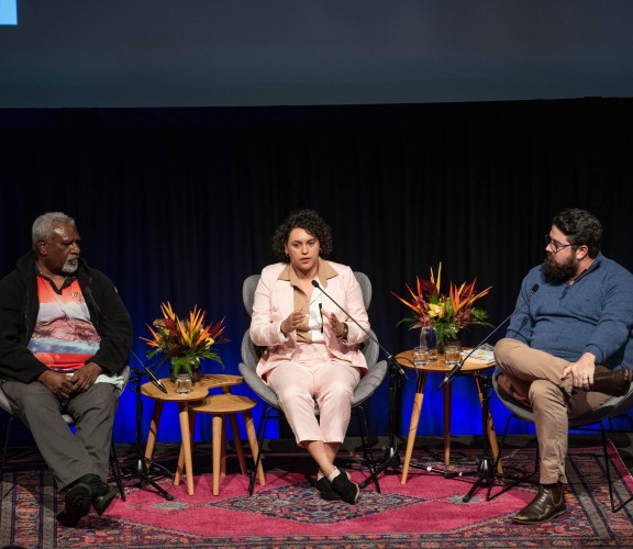 Three people on a panel discussing the Mabo case 