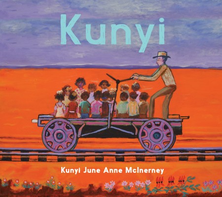 Cover of Kunyi by Kunyi June Anne McInerney A man in a hat is pushing a group of small children on a railway handcar A red desert is illustrated behind them
