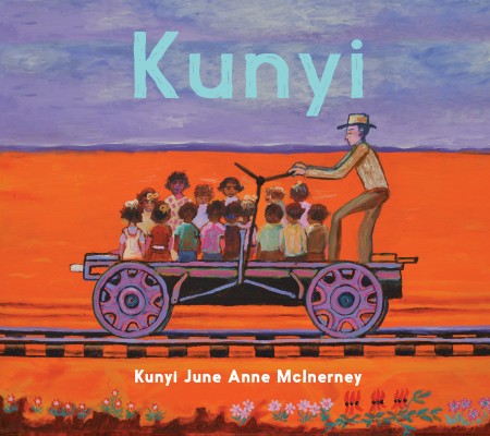 Cover of Kunyi by Kunyi June Anne McInerney. A man in a hat is pushing a group of small children on a railway handcar. A red desert is illustrated behind them.