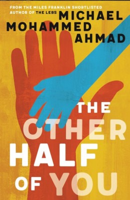 Cover of The Other Half of You by Michael Mohammed Ahmad. It's a yellow illustrated cover with a large orange hand and a small blue hand placed over it