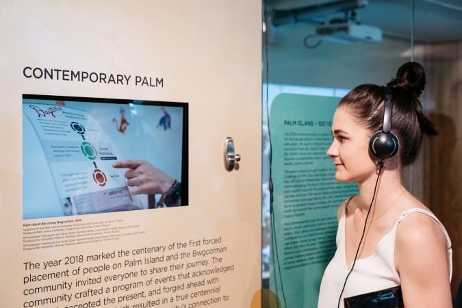 A person views a video in the Palm Island and Our People Exhibition Launch