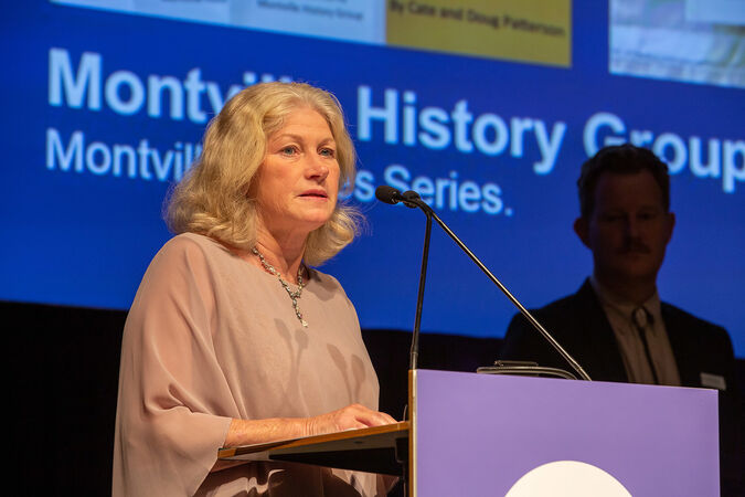 Cate Patterson accepting the 2021 John Oxley Community History Award on behalf of the Montville Historical Group. The group was awarded the award in recognition for producing their Montville Stories Series.
