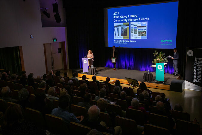 Cate Patterson accepting the 2021 John Oxley Community History Award on behalf of the Montville Historical Group. The group was awarded the award in recognition for producing their Montville Stories Series.