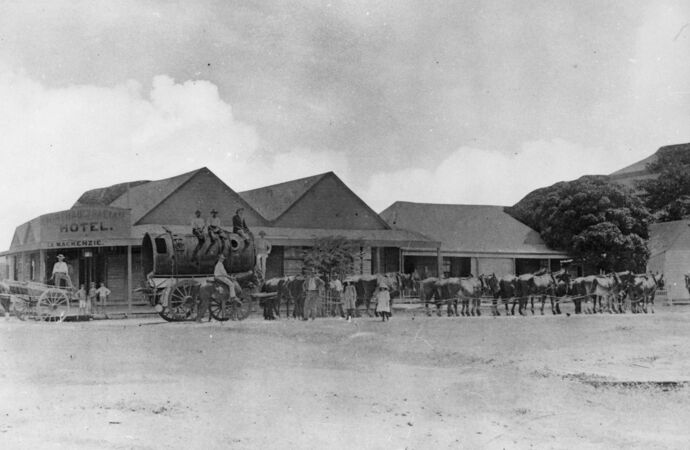 Horse-drawn wagon outside late 1800s building with words North Australian Hotel