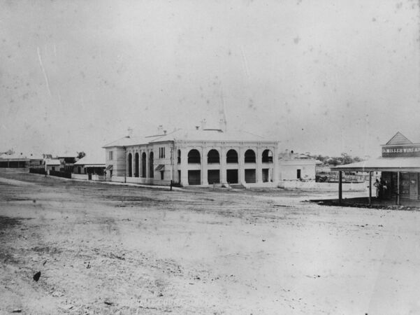 Grand 19th century courthouse on dirt street