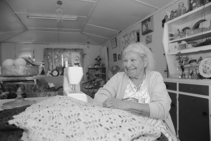 Evelyn Parter, an Australian South Sea Islander, sitting inside her home in Joskeleigh, Queensland, 2000.