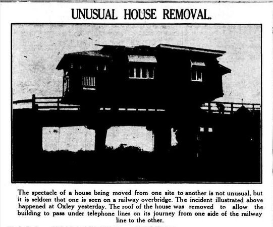 a house in Oxley being moved across a railway bridge