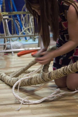 Britt Ouston, Assistant Curator, wrapping Mangrove installation in SLQ Gallery